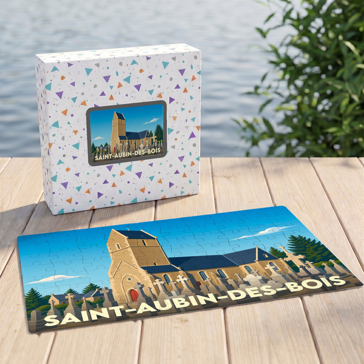 Puzzle souvenir de la ville de Saint-Aubin-des-Bois avec une illustration stylisée d'une église et son cimetière.