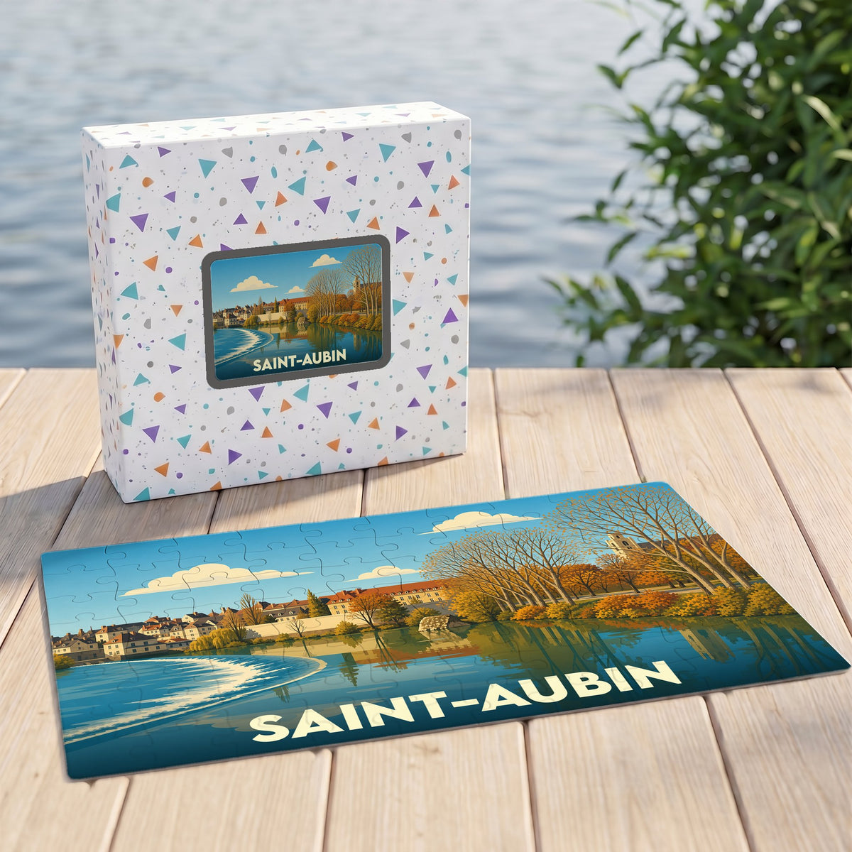 Puzzle souvenir de la ville de Saint-Aubin avec une illustration stylisée d'un paysage automnal en bord de l'eau.