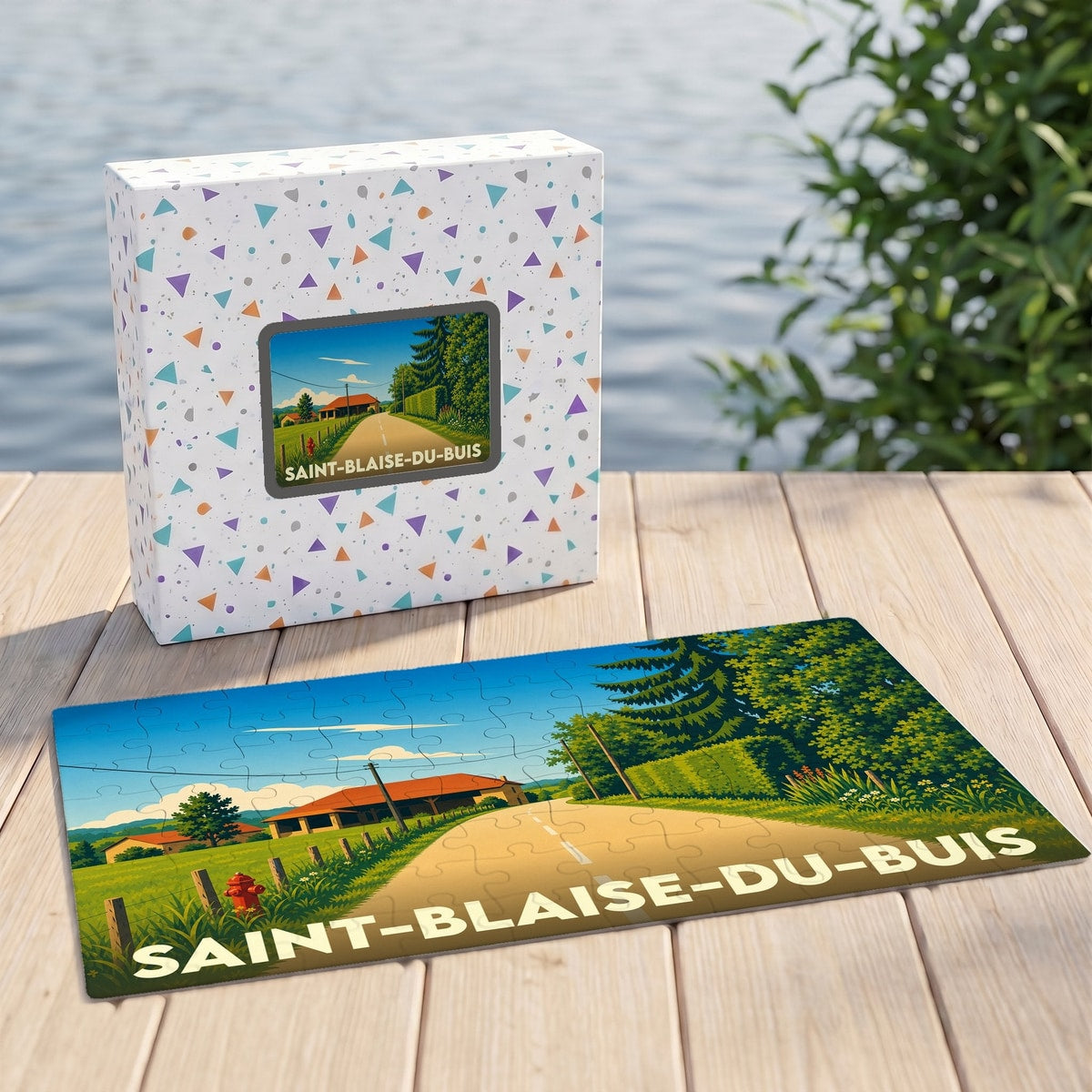 Puzzle souvenir de la ville de Saint-Blaise-du-Buis avec une illustration stylisée d'un paysage rural.
