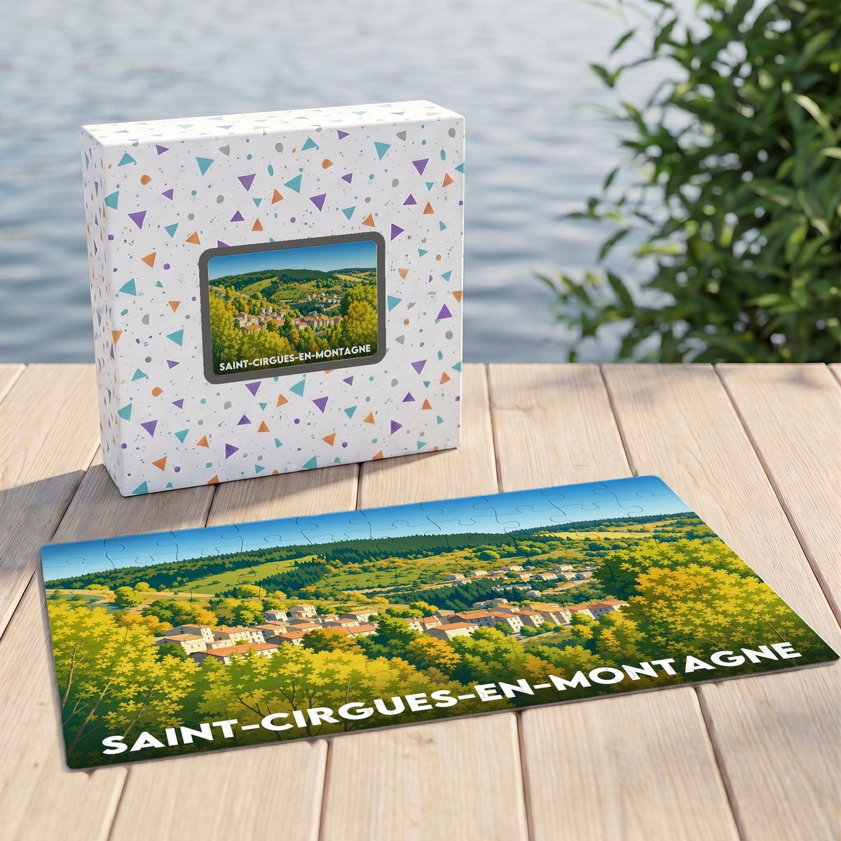 Puzzle souvenir de la ville de Saint-Cirgues-en-Montagne avec une illustration paysagère stylisée.