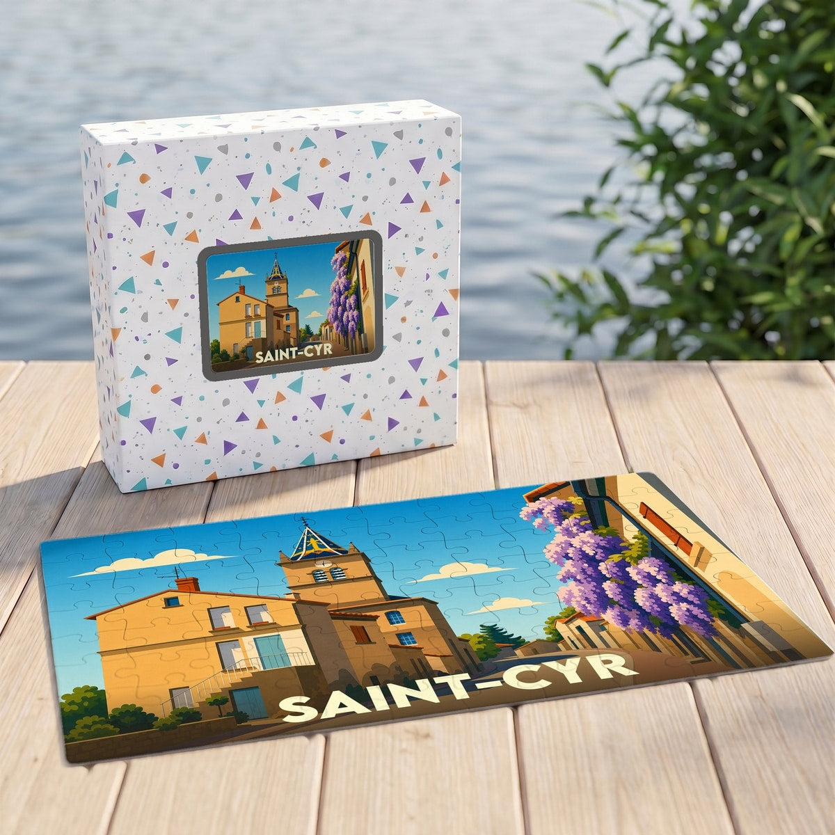 Puzzle souvenir de la ville de Saint-Cyr avec une illustration stylisée d'un village provençal.