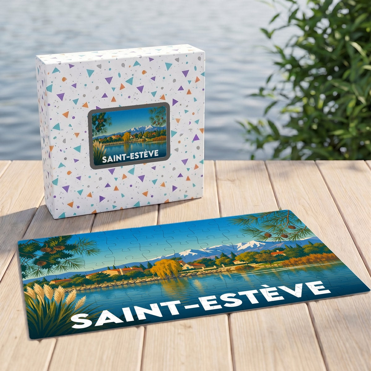 Puzzle souvenir de la ville de Saint-Estève avec une illustration stylisée d'un paysage lacustre.