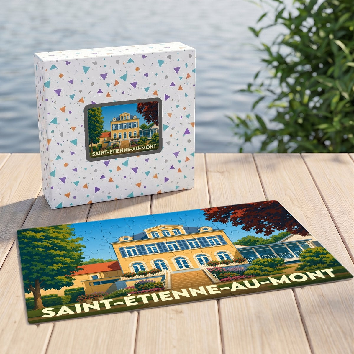 Puzzle souvenir de la ville de Saint-Étienne-au-Mont avec une illustration stylisée d'un manoir.