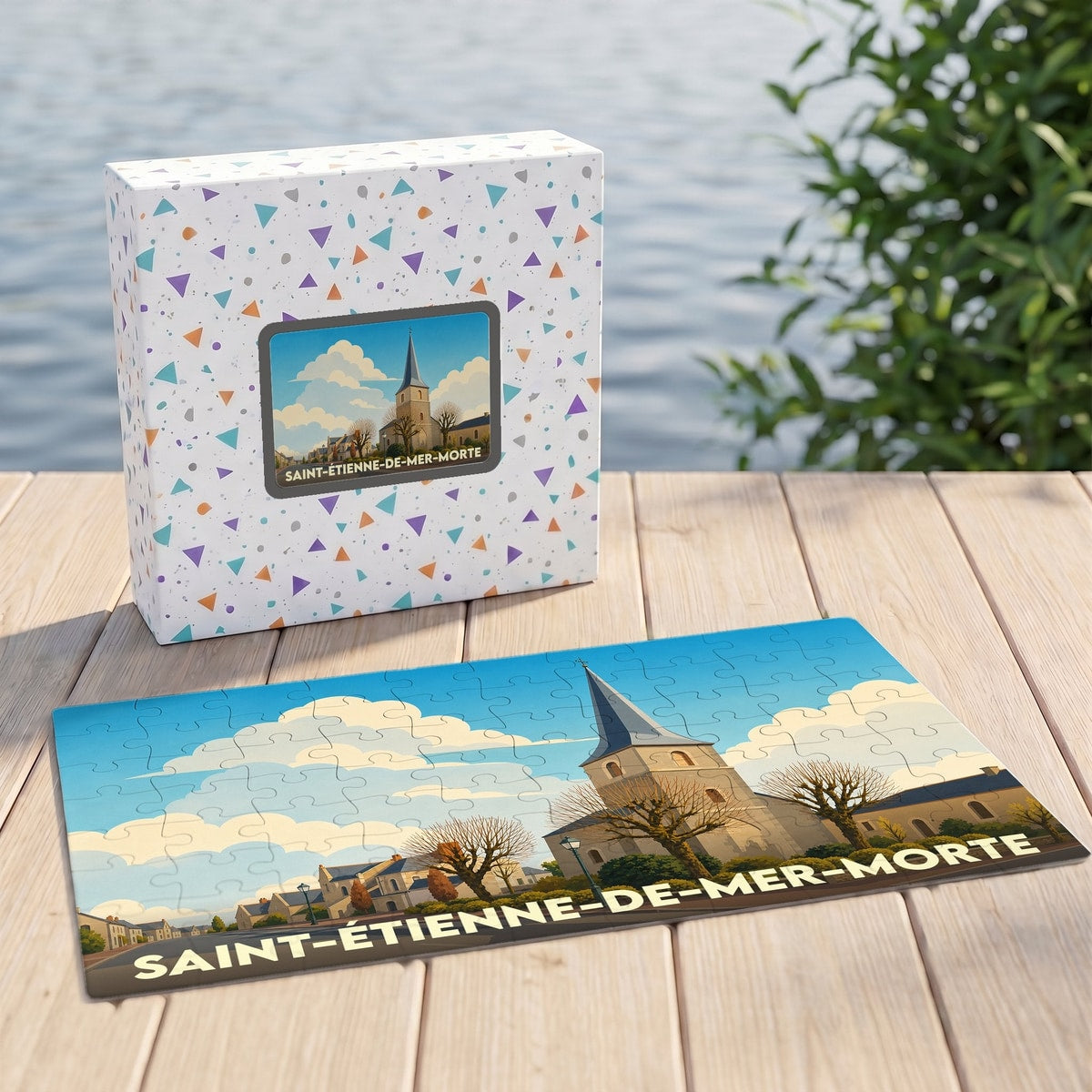 Puzzle souvenir de la ville de Saint-Étienne-de-Mer-Morte avec une illustration stylisée d'un clocher d'église.