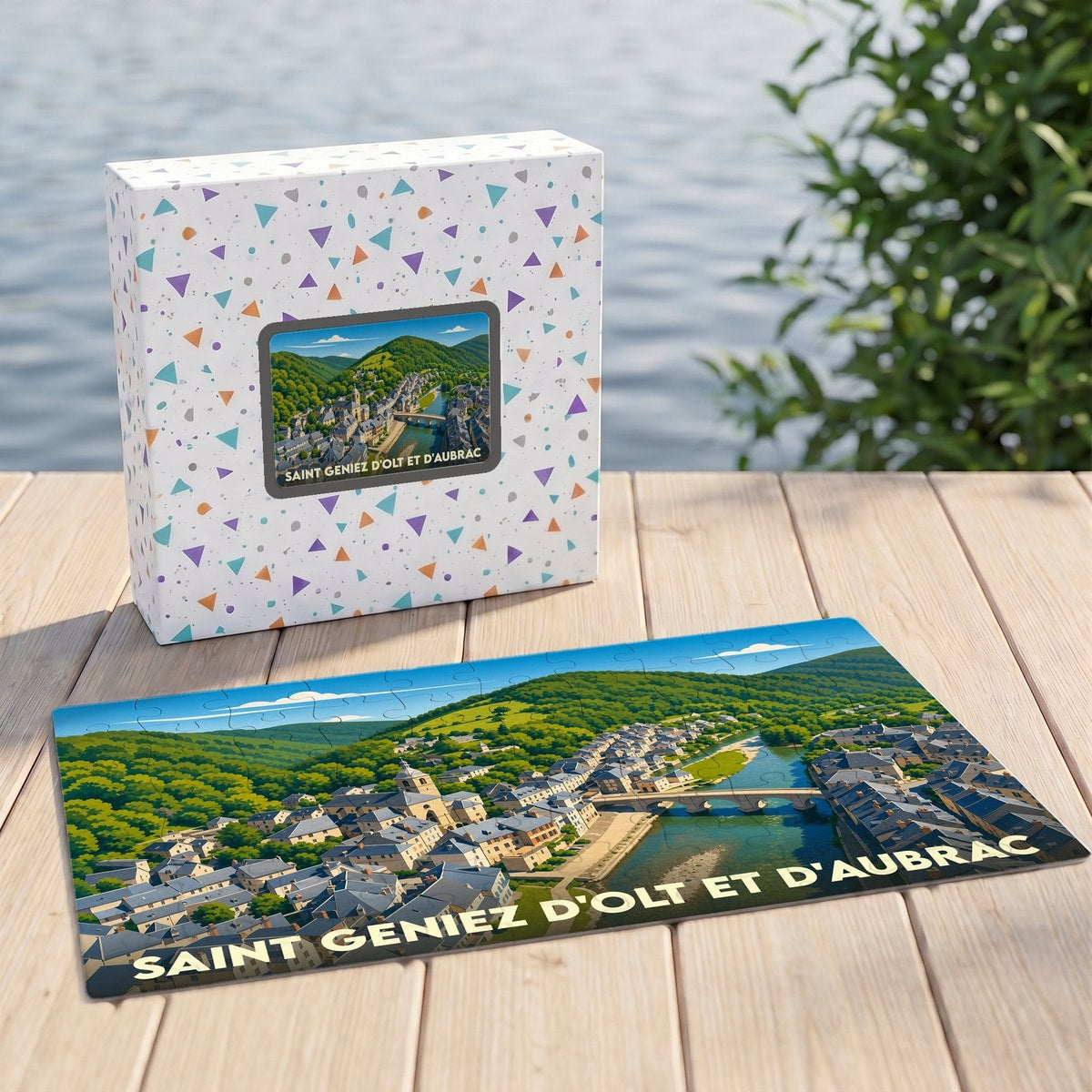 Puzzle souvenir de la ville de Saint Geniez d'Olt et d'Aubrac avec une illustration panoramique de la commune.