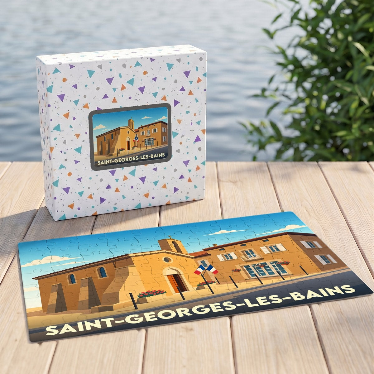 Puzzle souvenir de la ville de Saint-Georges-les-Bains avec une illustration stylisée d'un bâtiment provençal.
