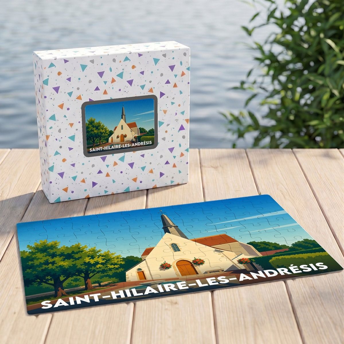 Puzzle souvenir de la ville de Saint-Hilaire-les-Andrésis avec une illustration stylisée de son église.