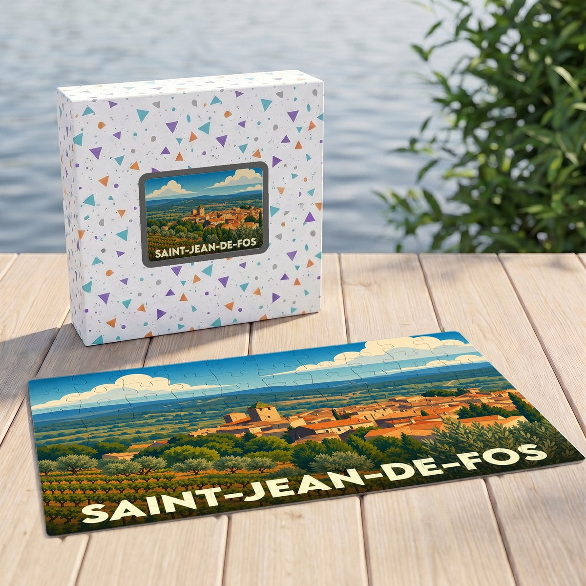 Puzzle souvenir de la ville de Saint-Jean-de-Fos avec une illustration stylisée de son paysage panoramique.
