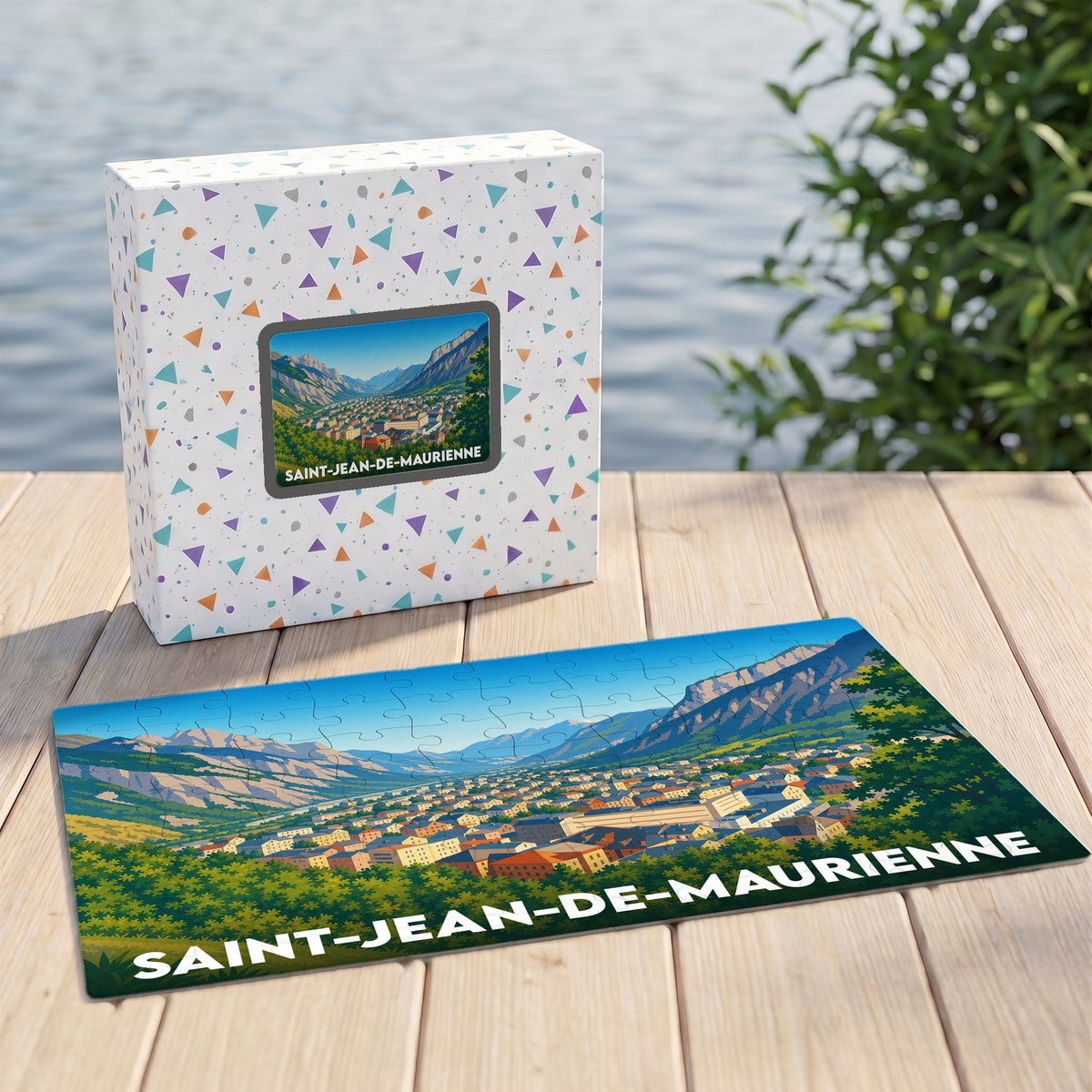 Puzzle souvenir de la ville de Saint-Jean-de-Maurienne avec une illustration stylisée de la vallée.