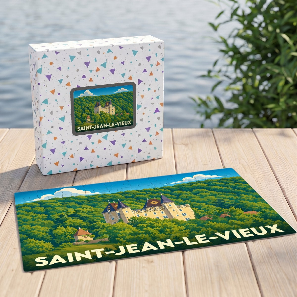 Puzzle souvenir de la ville de Saint-Jean-le-Vieux illustré d'un château entouré de forêt.