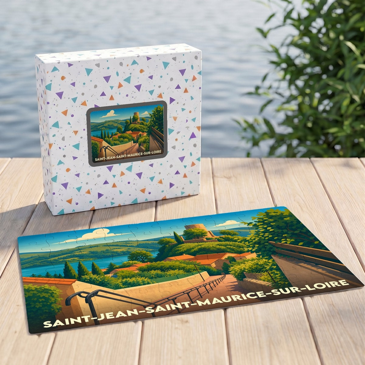 Puzzle souvenir de la ville de Saint-Jean-Saint-Maurice-sur-Loire avec une illustration stylisée représentant un paysage panoramique.