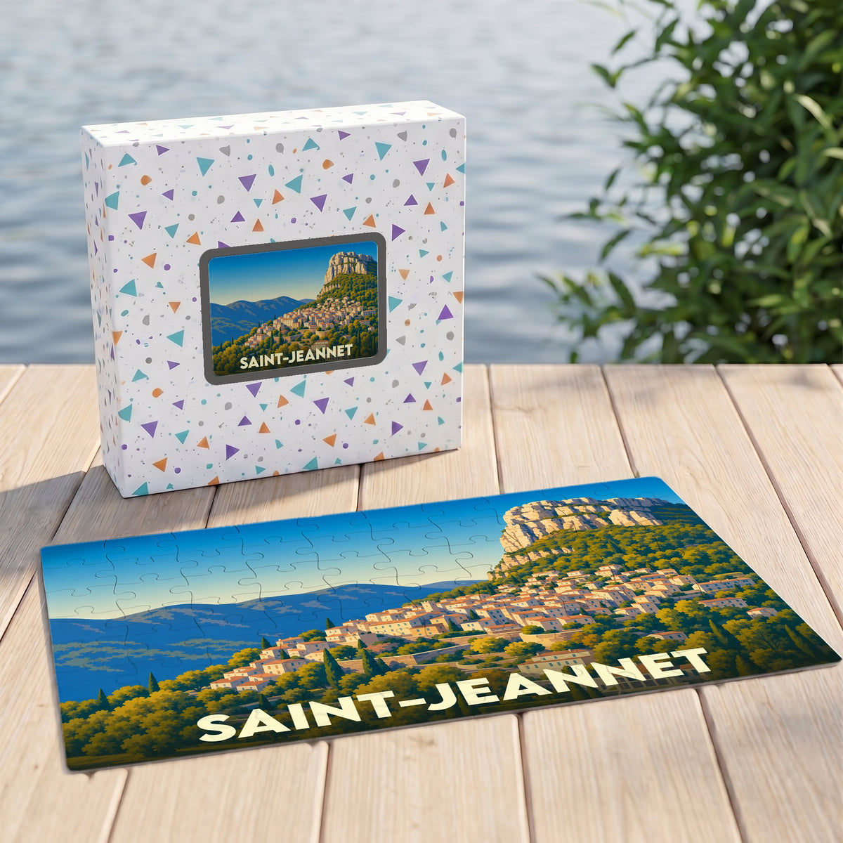 Puzzle souvenir de la ville de Saint-Jeannet avec une illustration stylisée de son célèbre baou et de ses maisons provençales.