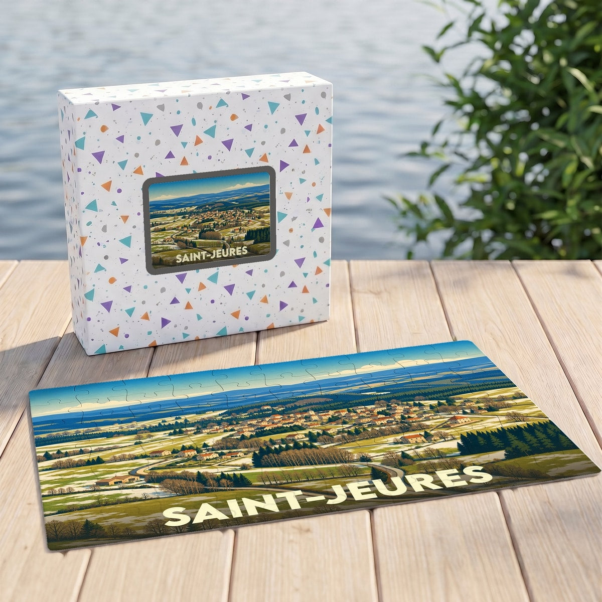 Puzzle souvenir de la ville de Saint-Jeures avec une illustration stylisée d'un paysage de campagne.