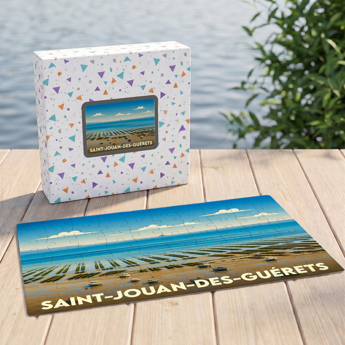 Puzzle souvenir de la ville de Saint-Jouan-des-Guérets avec une illustration stylisée de son paysage côtier.