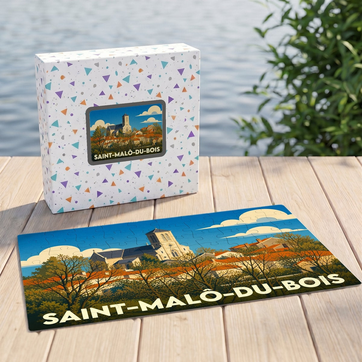 Puzzle souvenir de la ville de Saint-Malô-du-Bois avec une illustration stylisée et colorée du village.