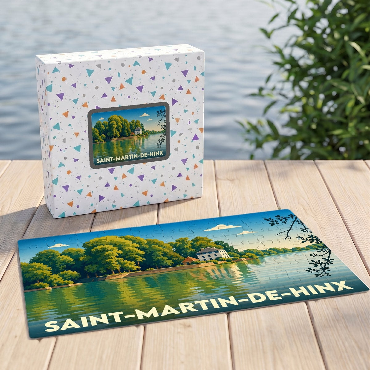 Puzzle souvenir de la ville de Saint-Martin-de-Hinx représentant un paysage de bord d'eau illustré.