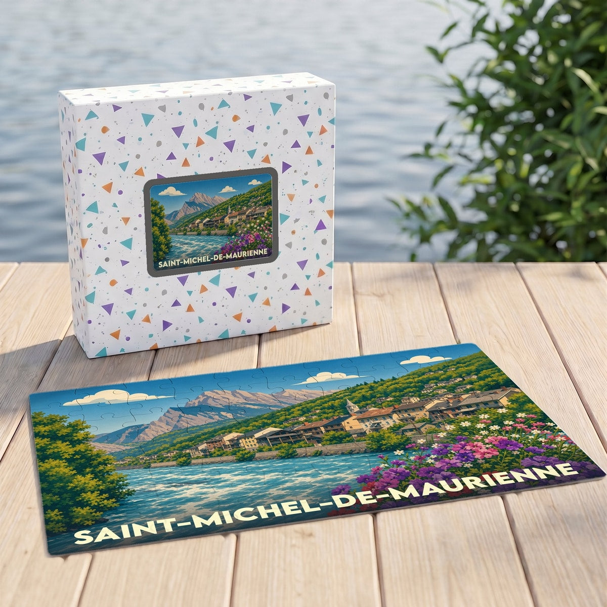 Puzzle souvenir de la ville de Saint-Michel-de-Maurienne représentant un paysage de montagne coloré au bord de l'eau.