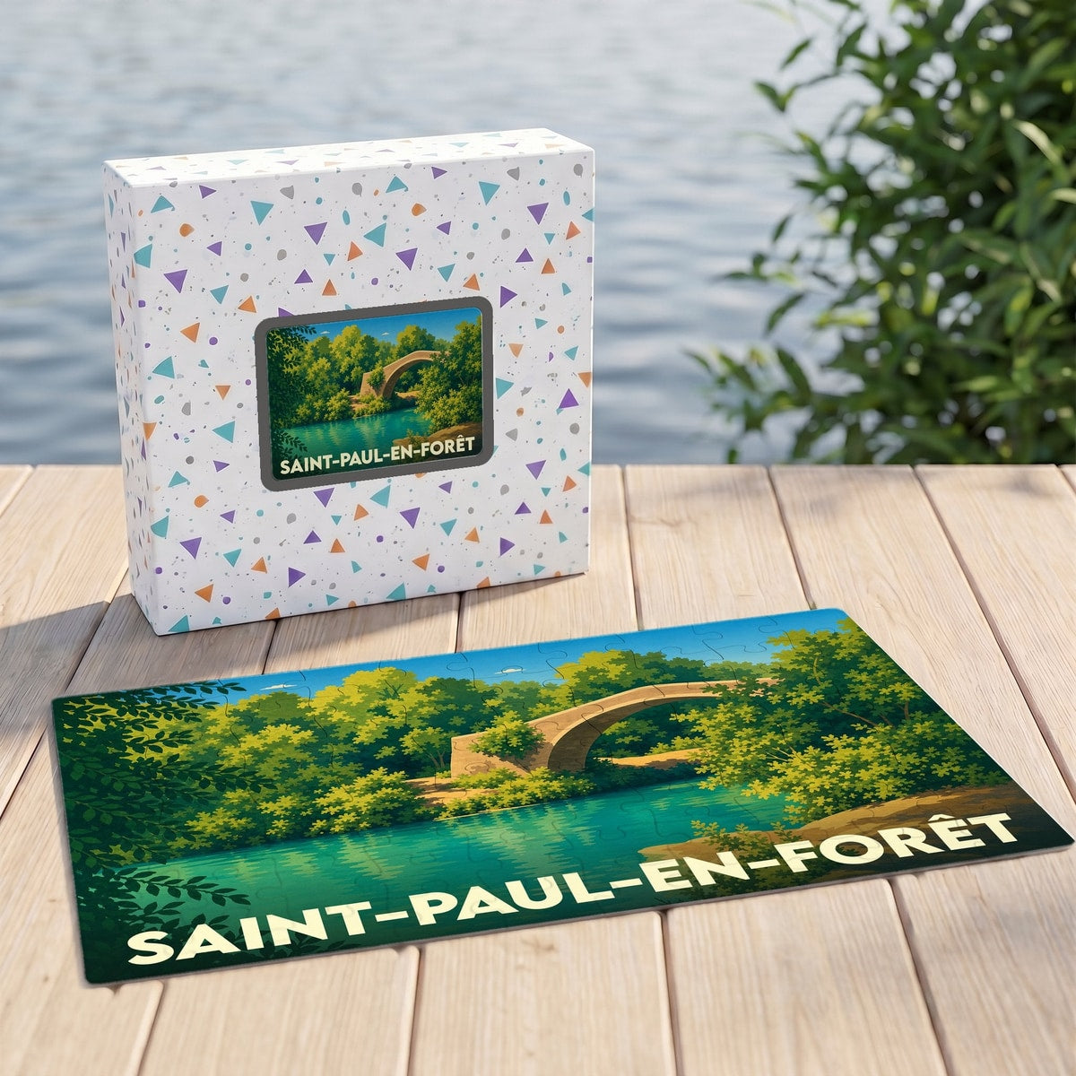 Puzzle souvenir de la ville de Saint-Paul-en-Forêt avec une illustration stylisée d'un pont en pierre.