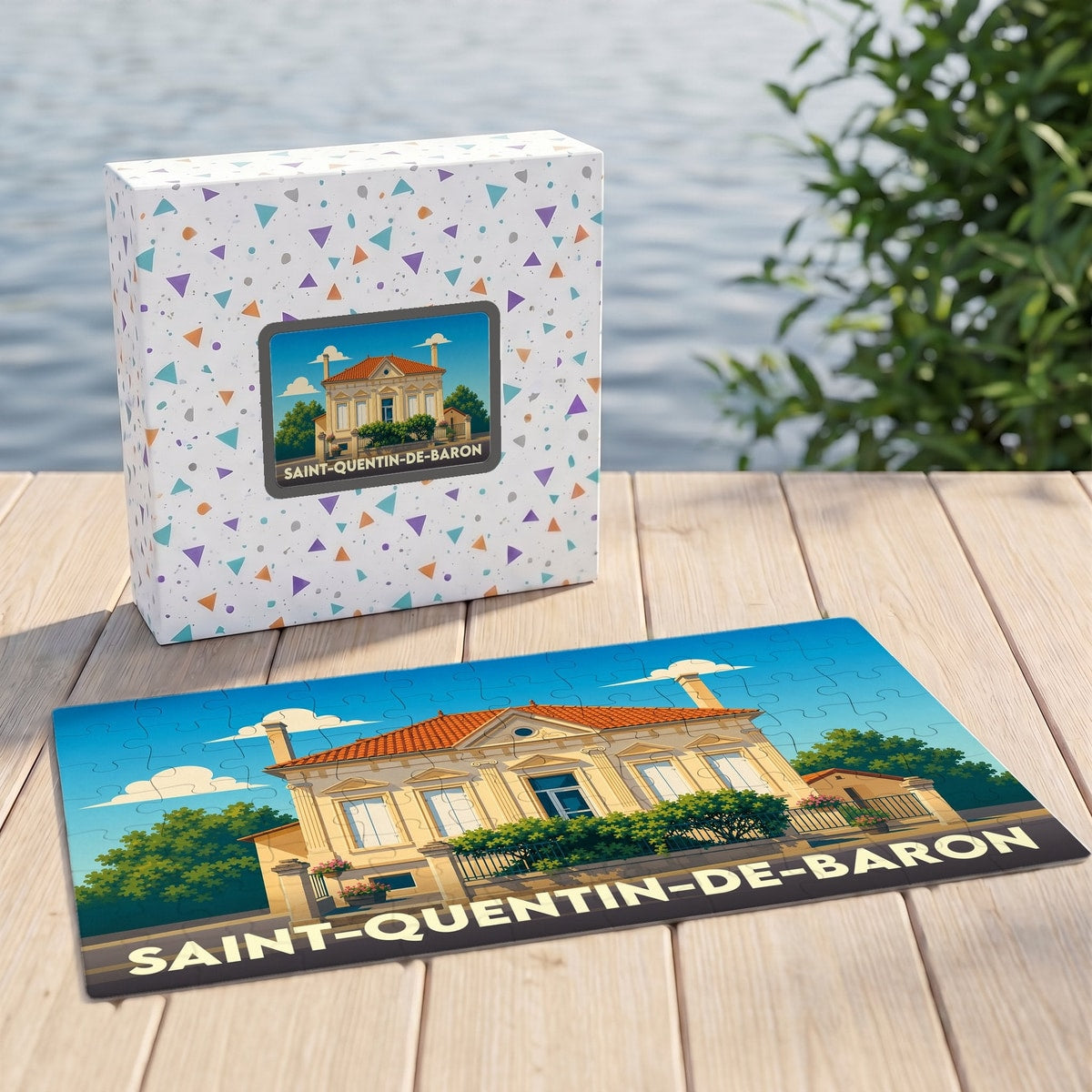 Puzzle souvenir de la ville de Saint-Quentin-de-Baron avec une illustration stylisée d'une demeure classique.