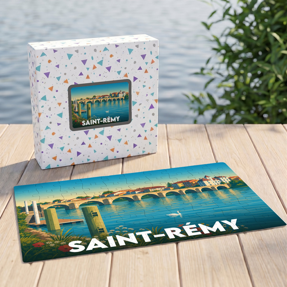 Puzzle souvenir de la ville de Saint-Rémy avec une illustration stylisée représentant un pont sur l'eau.