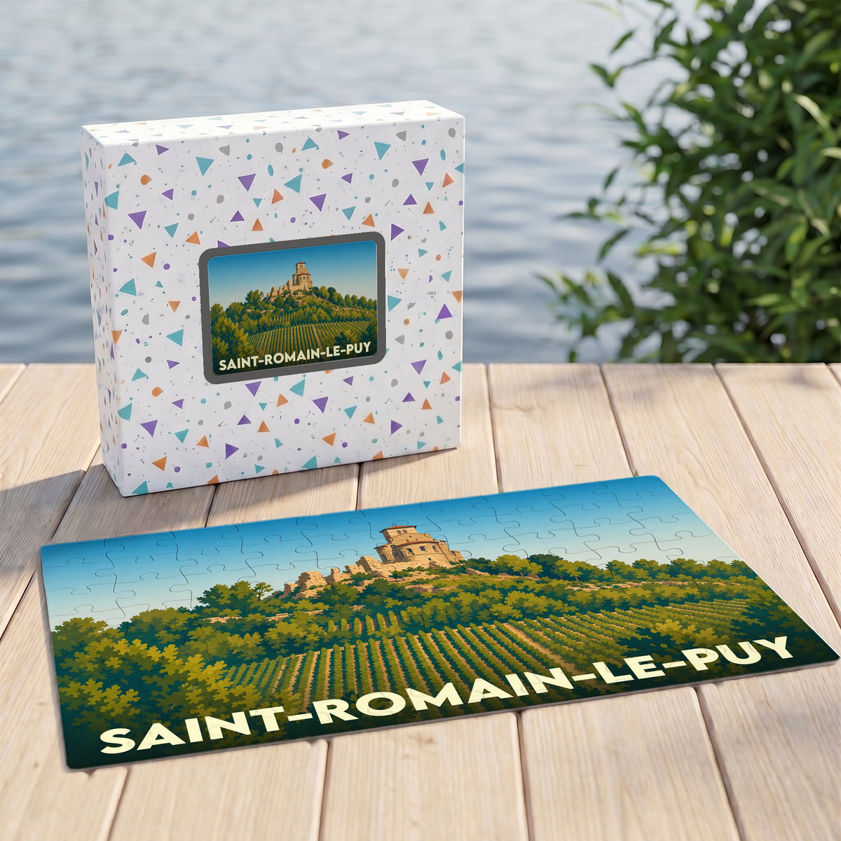 Puzzle souvenir de la ville de Saint-Romain-le-Puy représentant son prieuré dominant les vignes dans un style illustré.