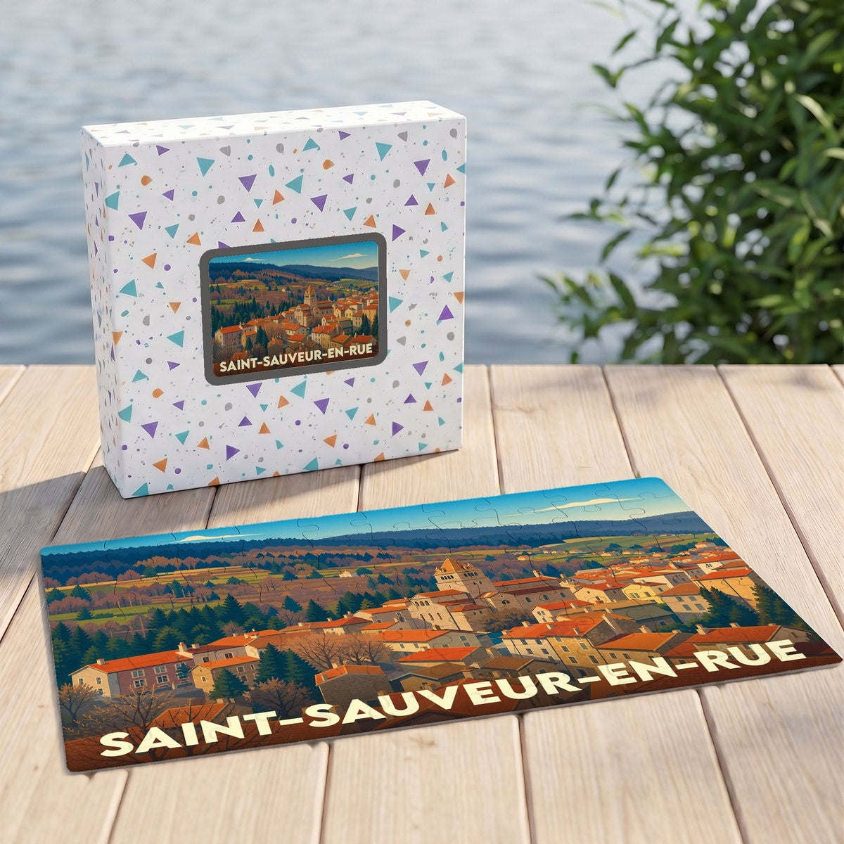 Puzzle souvenir de la ville de Saint-Sauveur-en-Rue avec une illustration stylisée de son paysage urbain et forestier.
