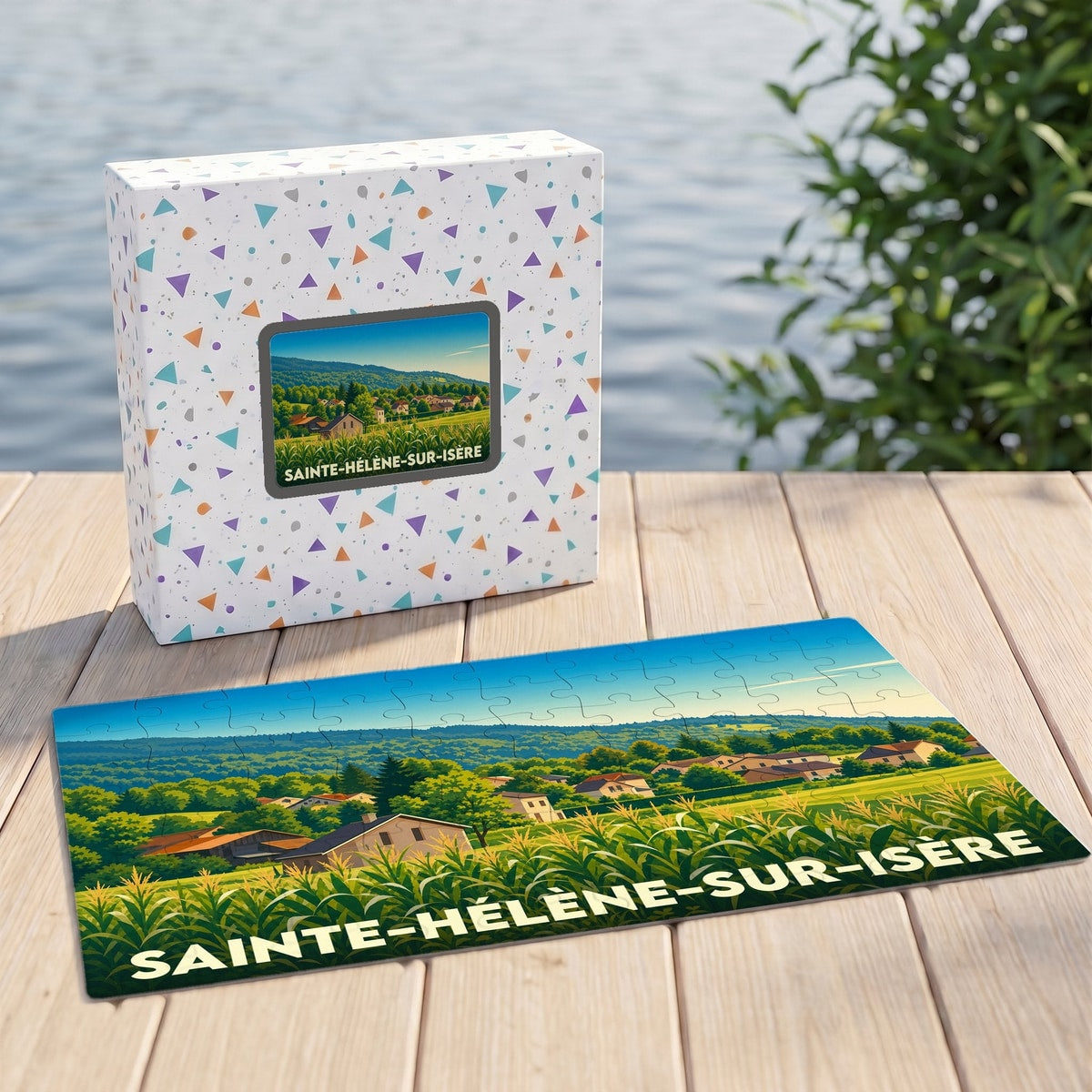 Puzzle souvenir de la ville de Sainte-Hélène-sur-Isère avec une illustration paysagère stylisée.