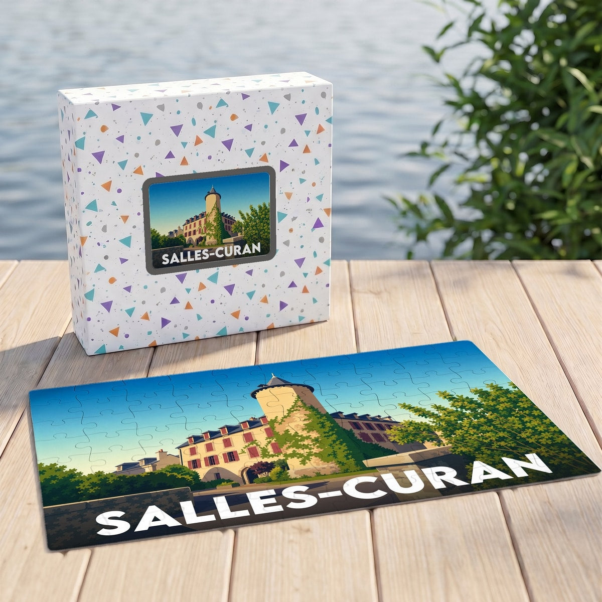 Puzzle souvenir de la ville de Salles-Curan avec une illustration stylisée d'un château.