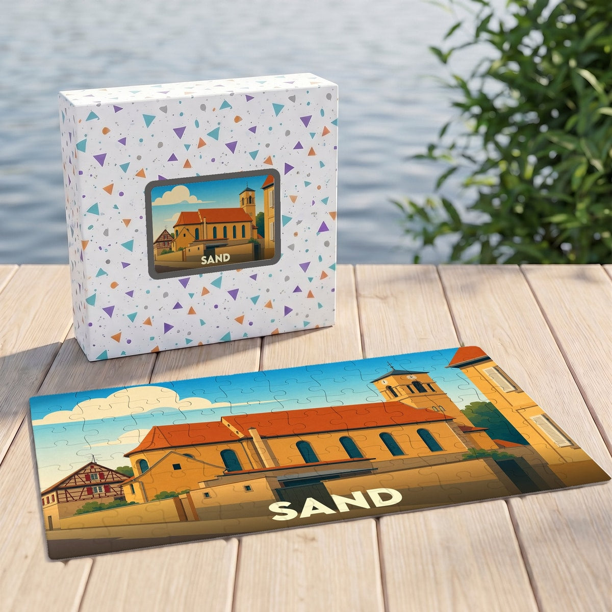 Puzzle souvenir de la ville de Sand présentant une illustration stylisée d'une église locale.