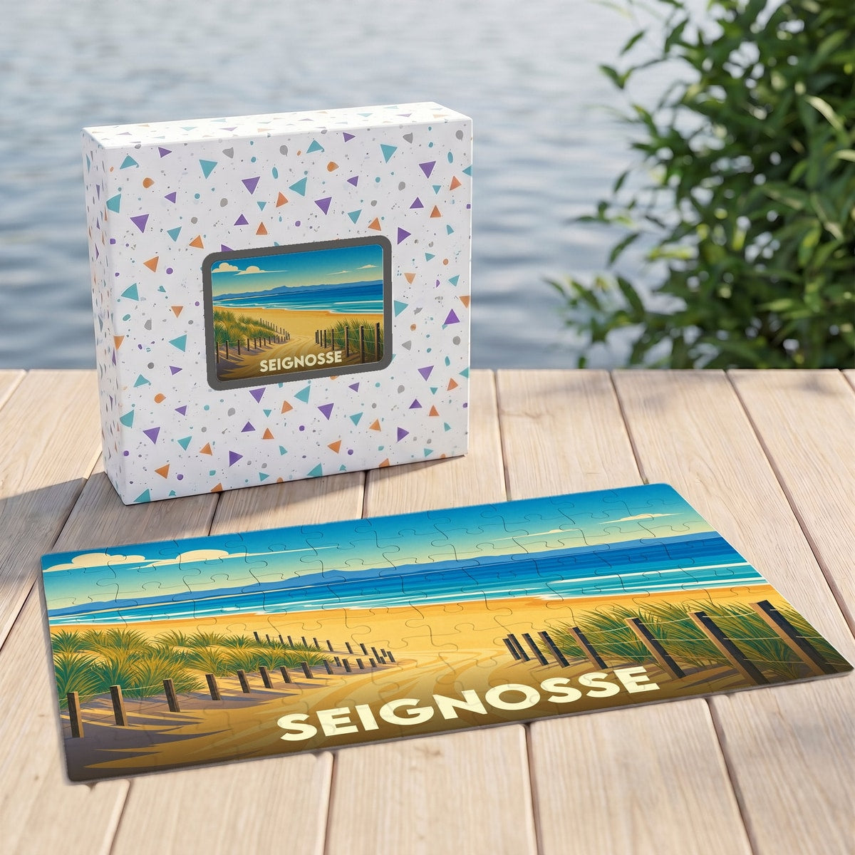 Puzzle souvenir de la ville de Seignosse avec une illustration stylisée d'un chemin de dune menant à l'océan.