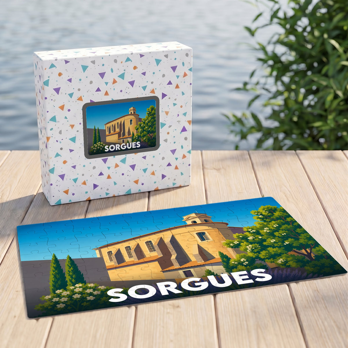 Puzzle souvenir de la ville de Sorgues avec une illustration stylisée d'un bâtiment historique et sa boîte assortie.