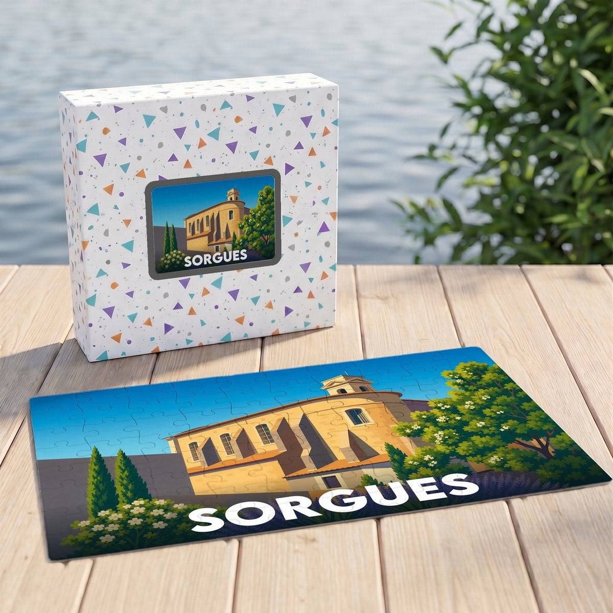 Puzzle souvenir de la ville de Sorgues avec une illustration stylisée d'un bâtiment historique et sa boîte assortie.