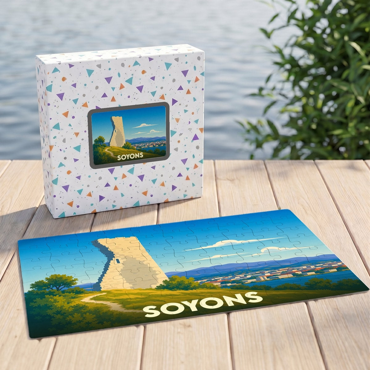 Puzzle souvenir de la ville de Soyons avec une illustration stylisée d'une tour médiévale.