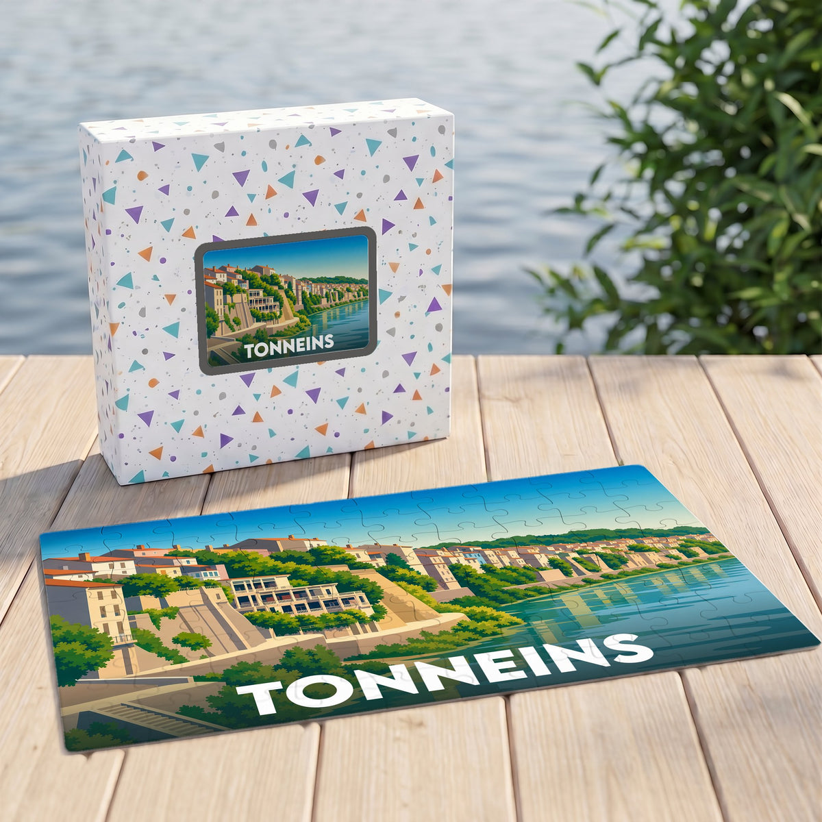 Puzzle souvenir de la ville de Tonneins présentant une illustration stylisée des quais de la Garonne.