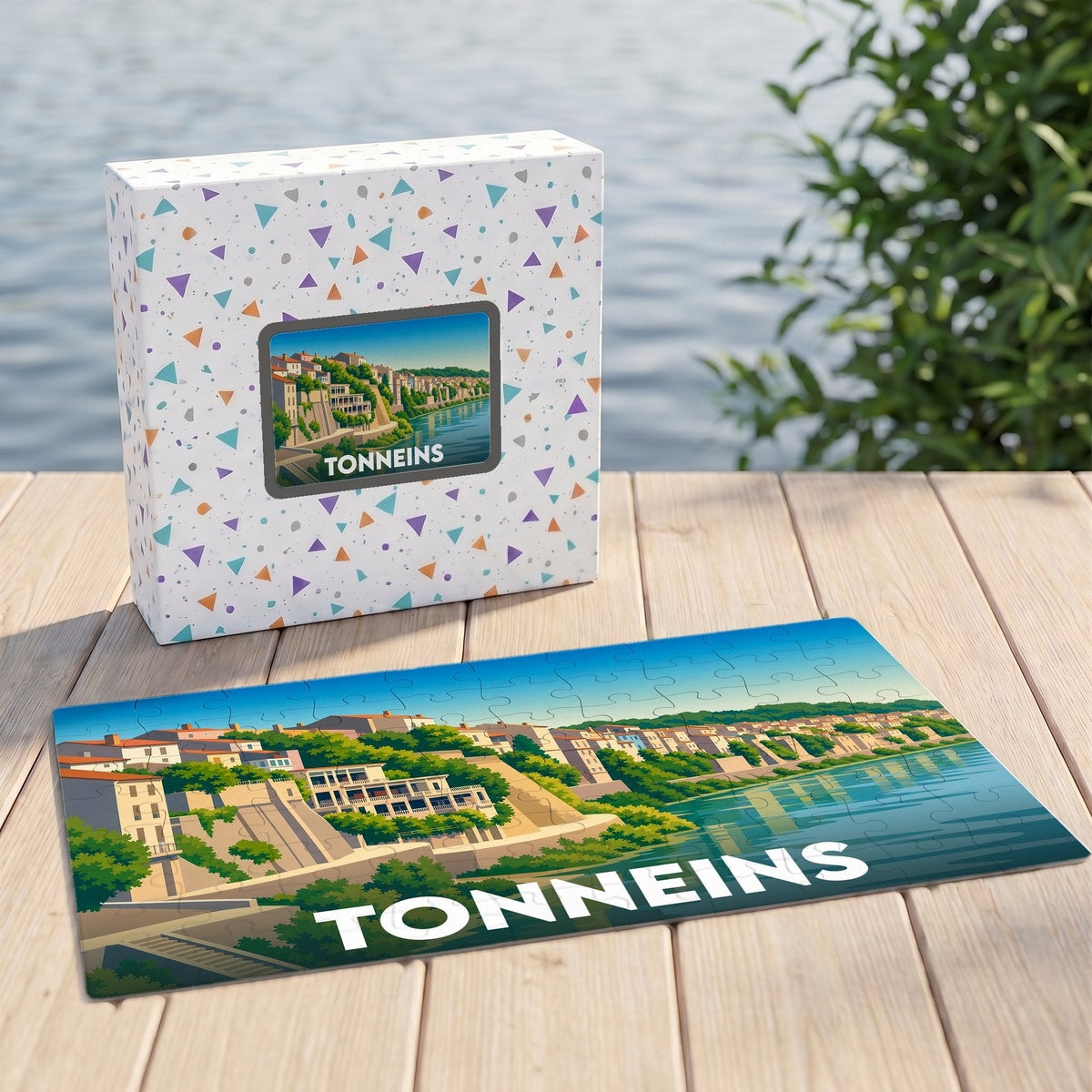 Puzzle souvenir de la ville de Tonneins présentant une illustration stylisée des quais de la Garonne.