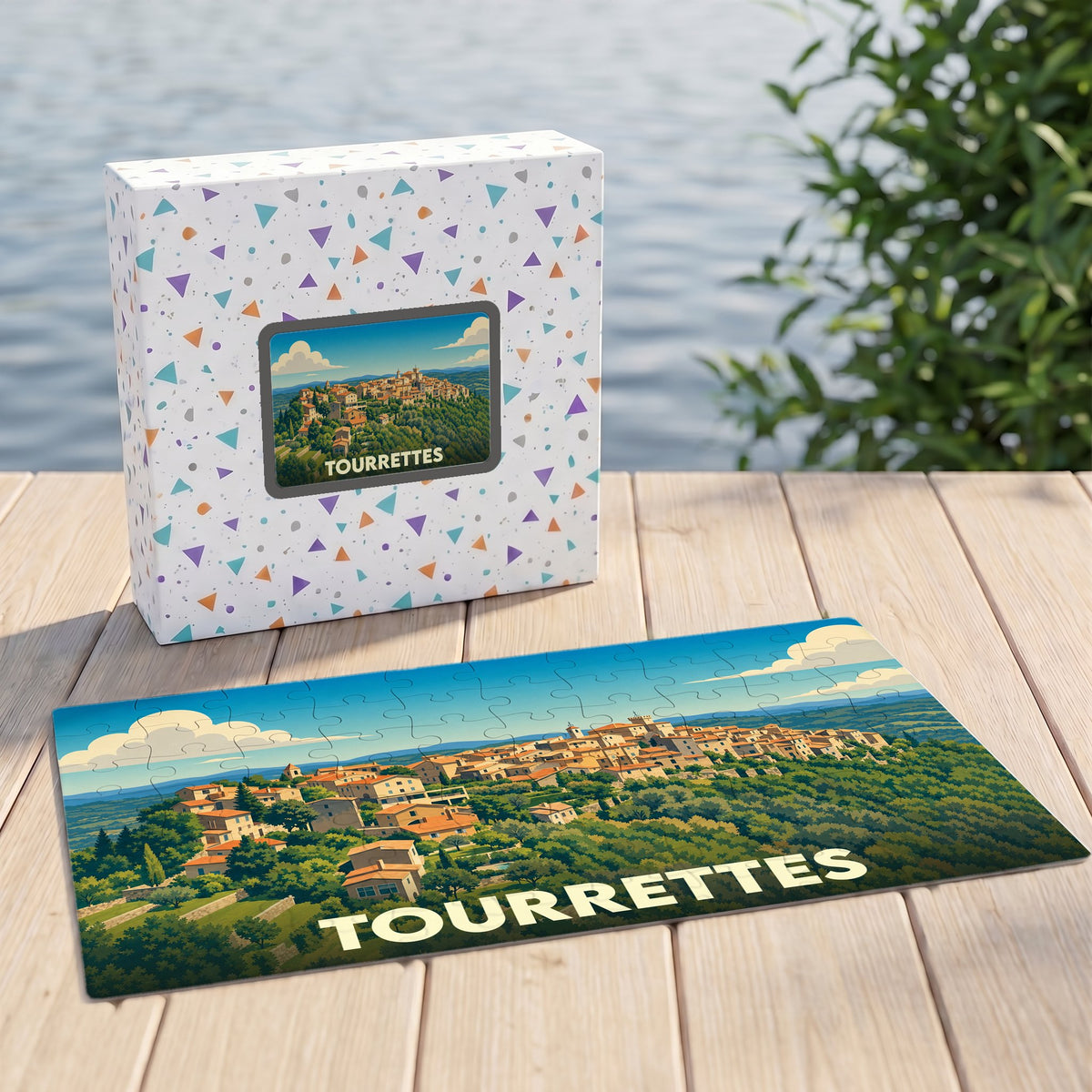 Puzzle souvenir de la ville de Tourrettes illustrant un paysage provençal avec sa boîte assortie.