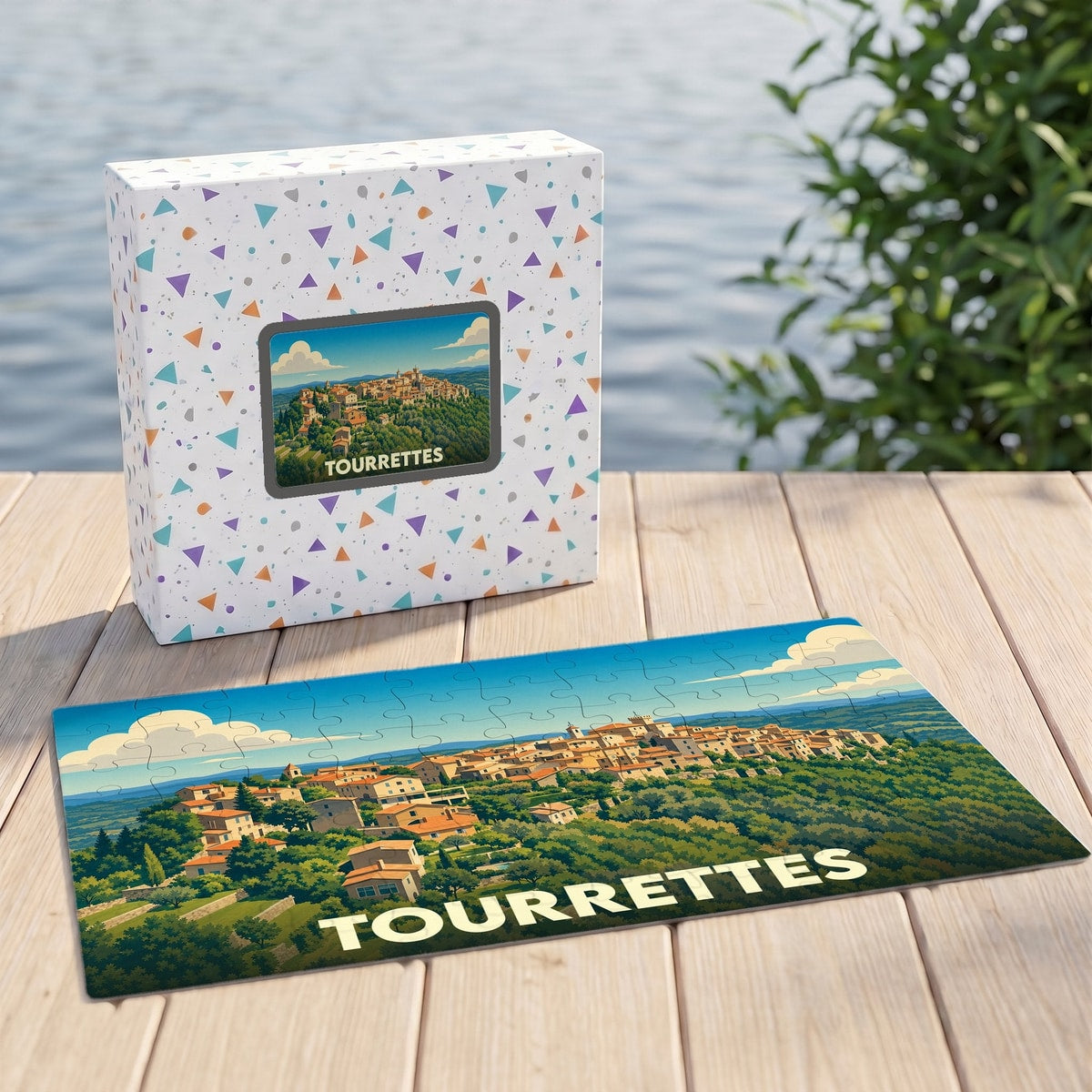 Puzzle souvenir de la ville de Tourrettes illustrant un paysage provençal avec sa boîte assortie.