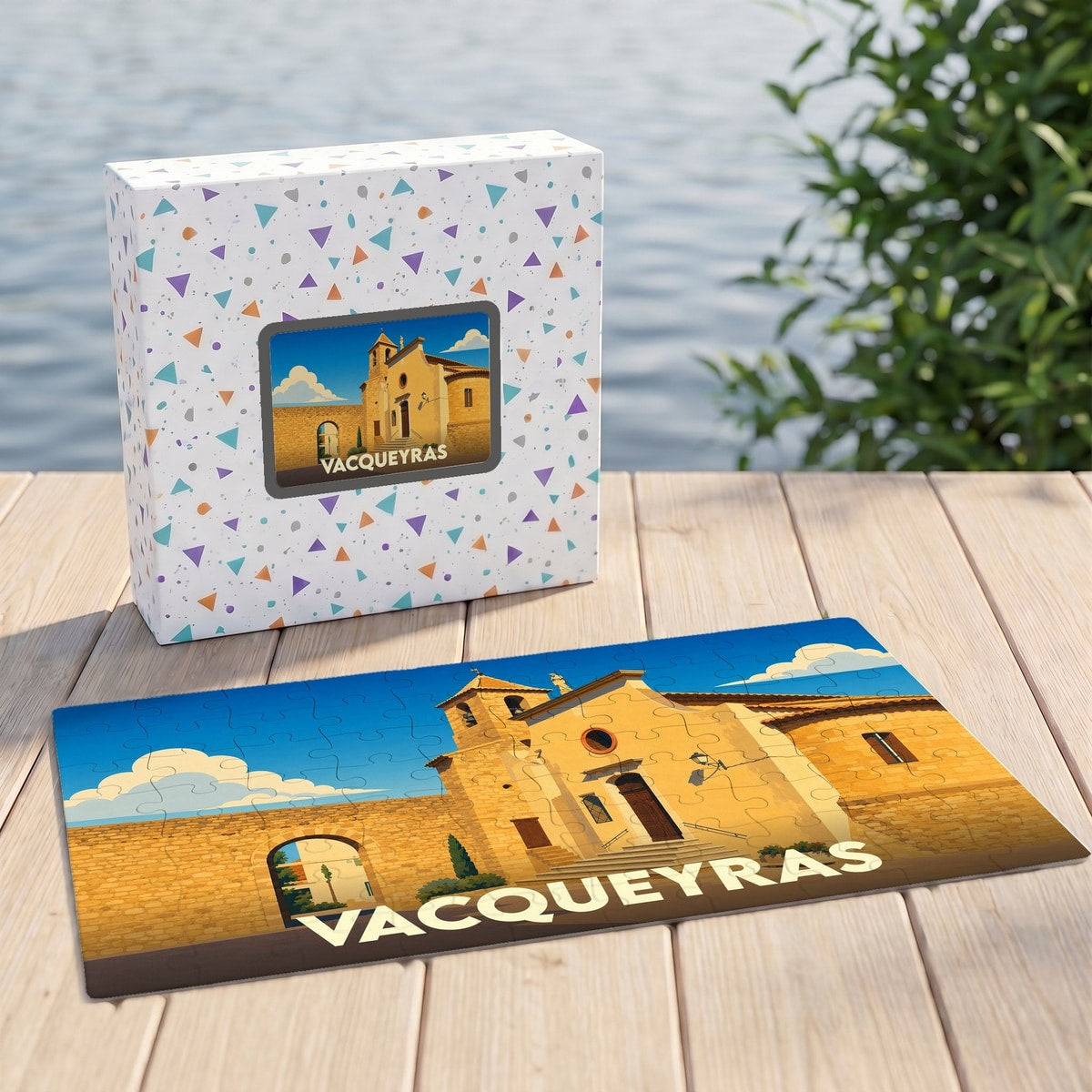 Puzzle souvenir de la ville de Vacqueyras avec une illustration stylisée et sa boîte assortie.