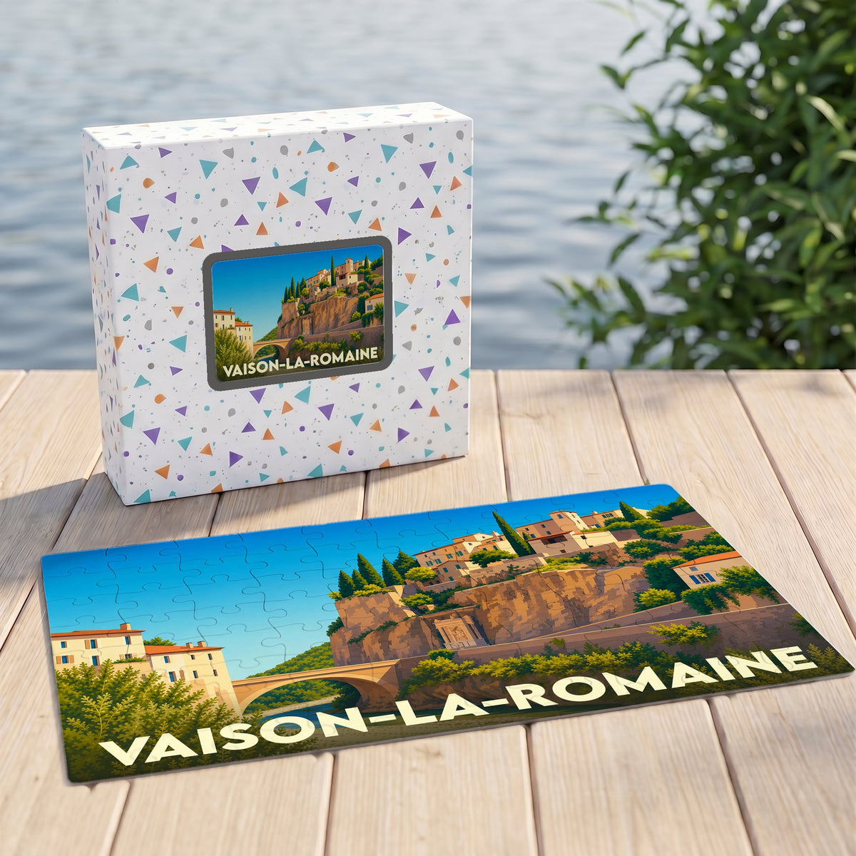 Puzzle souvenir de la ville de Vaison-la-Romaine avec une illustration stylisée de son pont romain et de sa cité médiévale.