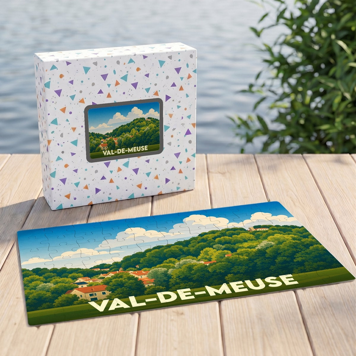 Puzzle souvenir de la ville de Val-de-Meuse avec une illustration de paysage vallonné.
