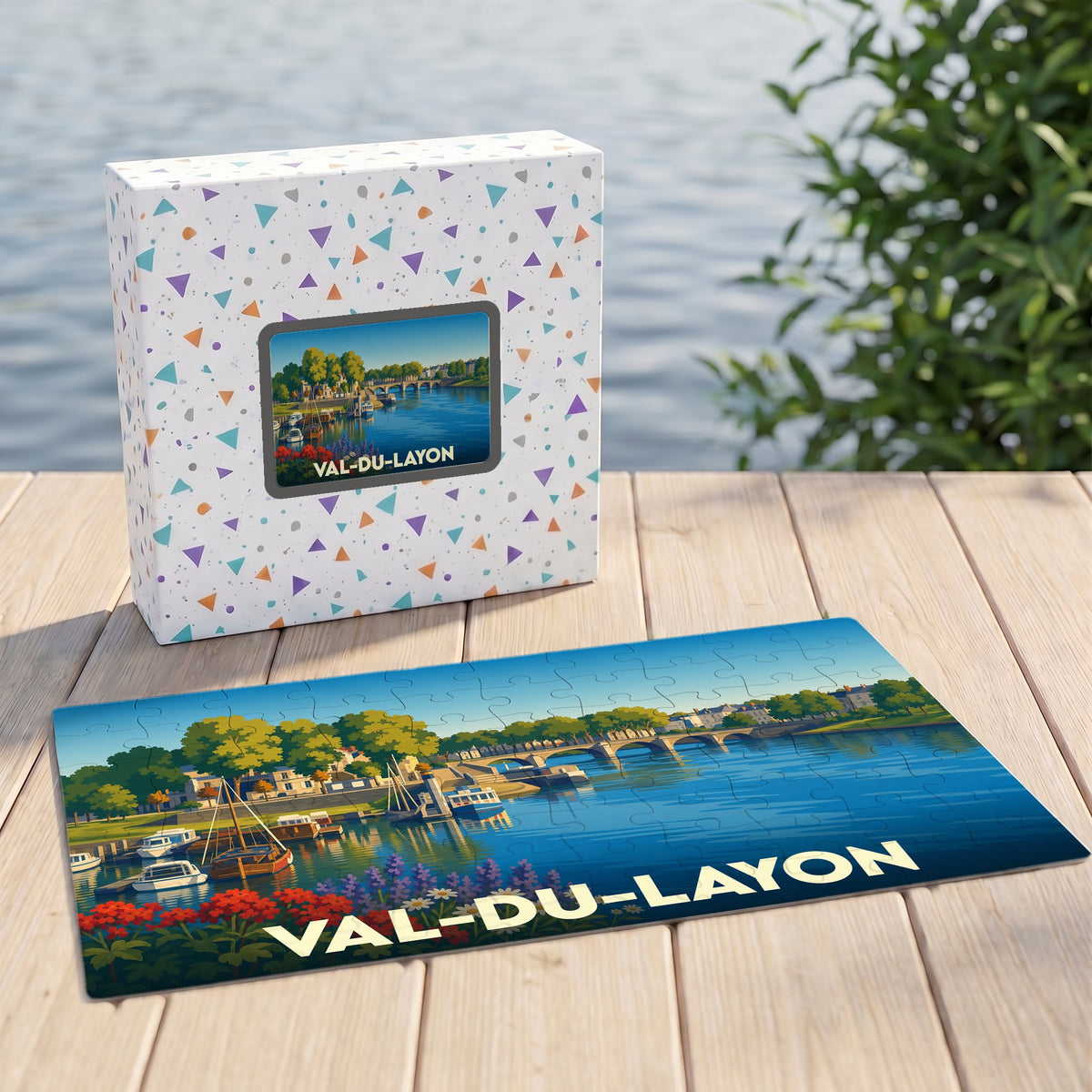 Puzzle souvenir de la ville de Val-du-Layon avec une illustration stylisée d'un paysage fluvial.