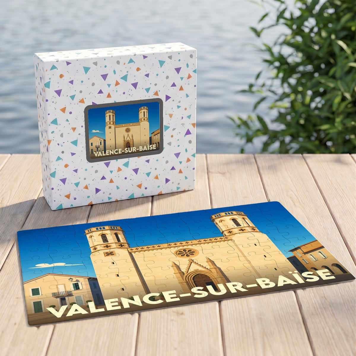 Puzzle souvenir de la ville de Valence-sur-Baïse avec une illustration stylisée de son église et de sa boîte assortie.