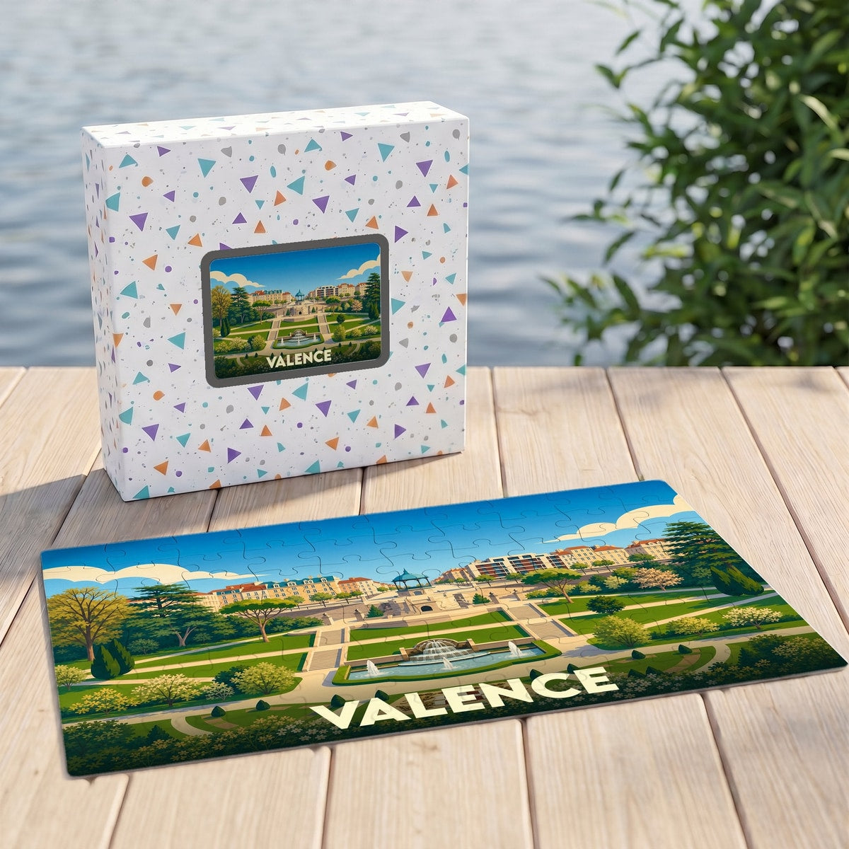 Puzzle souvenir de la ville de Valence avec une illustration stylisée d'un parc et de sa fontaine.