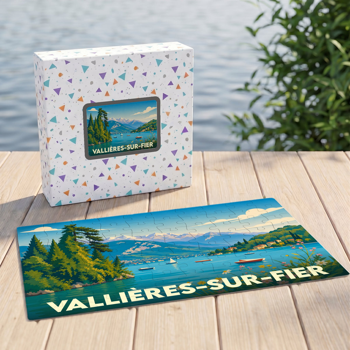 Puzzle souvenir de la ville de Vallières-sur-Fier avec une illustration stylisée de paysage lacustre.
