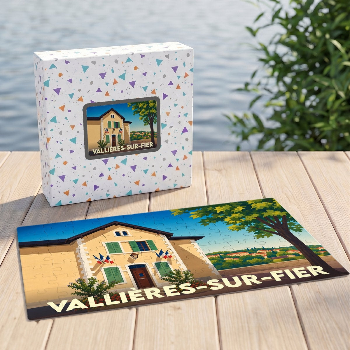 Puzzle souvenir de la ville de Vallières-sur-Fier avec son emballage et une illustration stylisée.