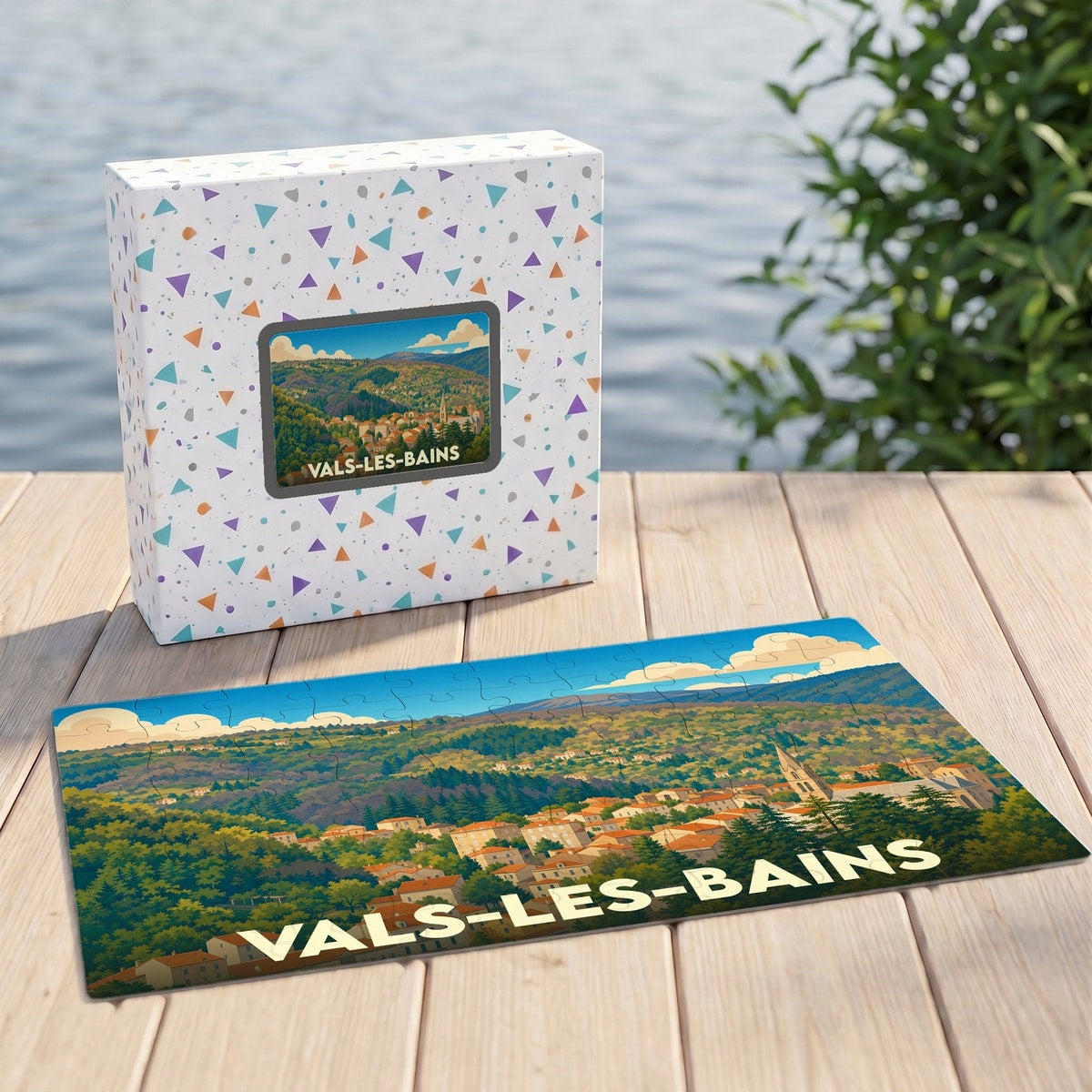 Puzzle souvenir de la ville de Vals-les-Bains avec une illustration de paysage vallonné.