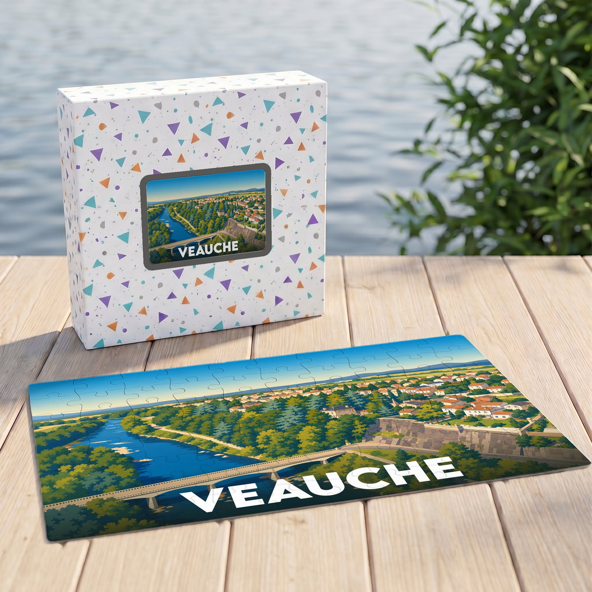 Puzzle souvenir de la ville de Veauche avec une illustration stylisée d'un paysage fluvial et urbain.