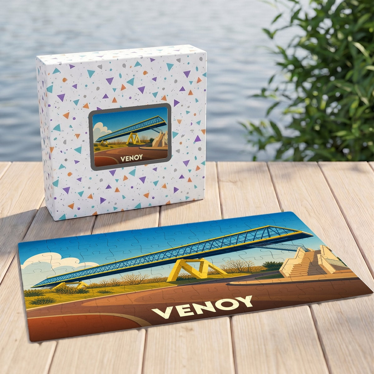 Puzzle souvenir de la ville de Venoy illustrant une passerelle moderne sur un fond paysager coloré.