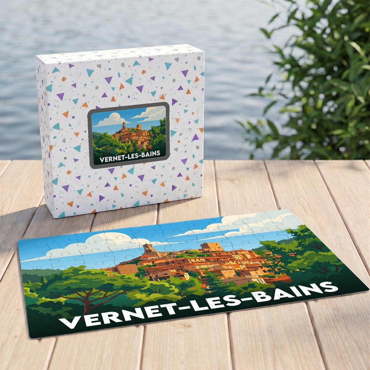 Puzzle souvenir de la ville de Vernet-les-Bains avec une illustration stylisée et sa boîte assortie.