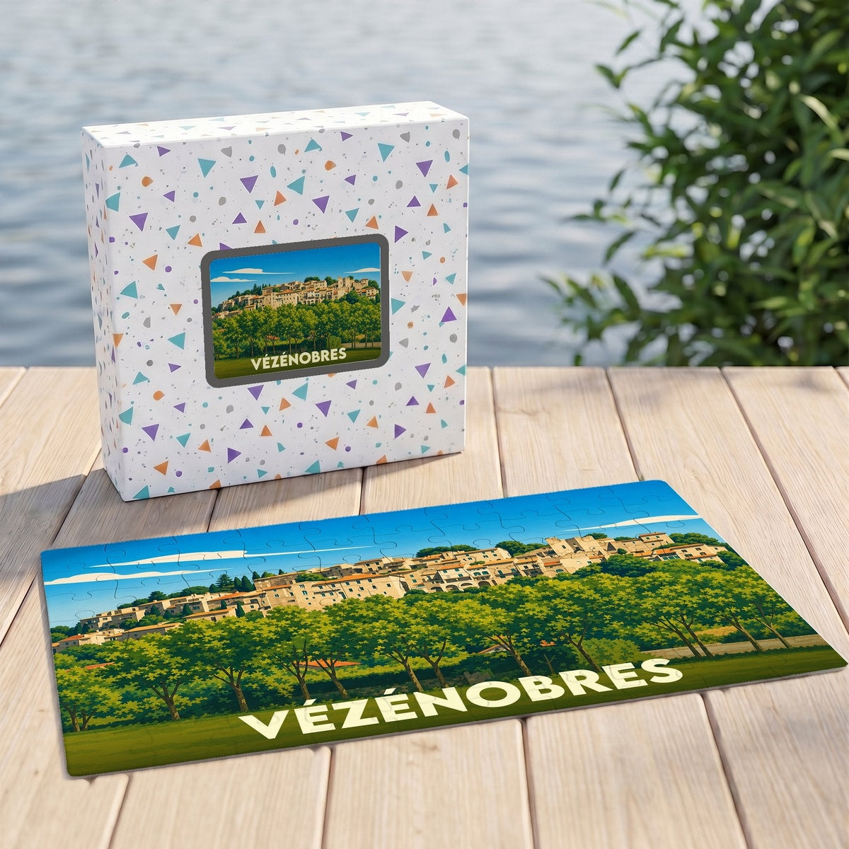 Puzzle souvenir de la ville de Vézénobres avec une illustration stylisée d'un village perché.